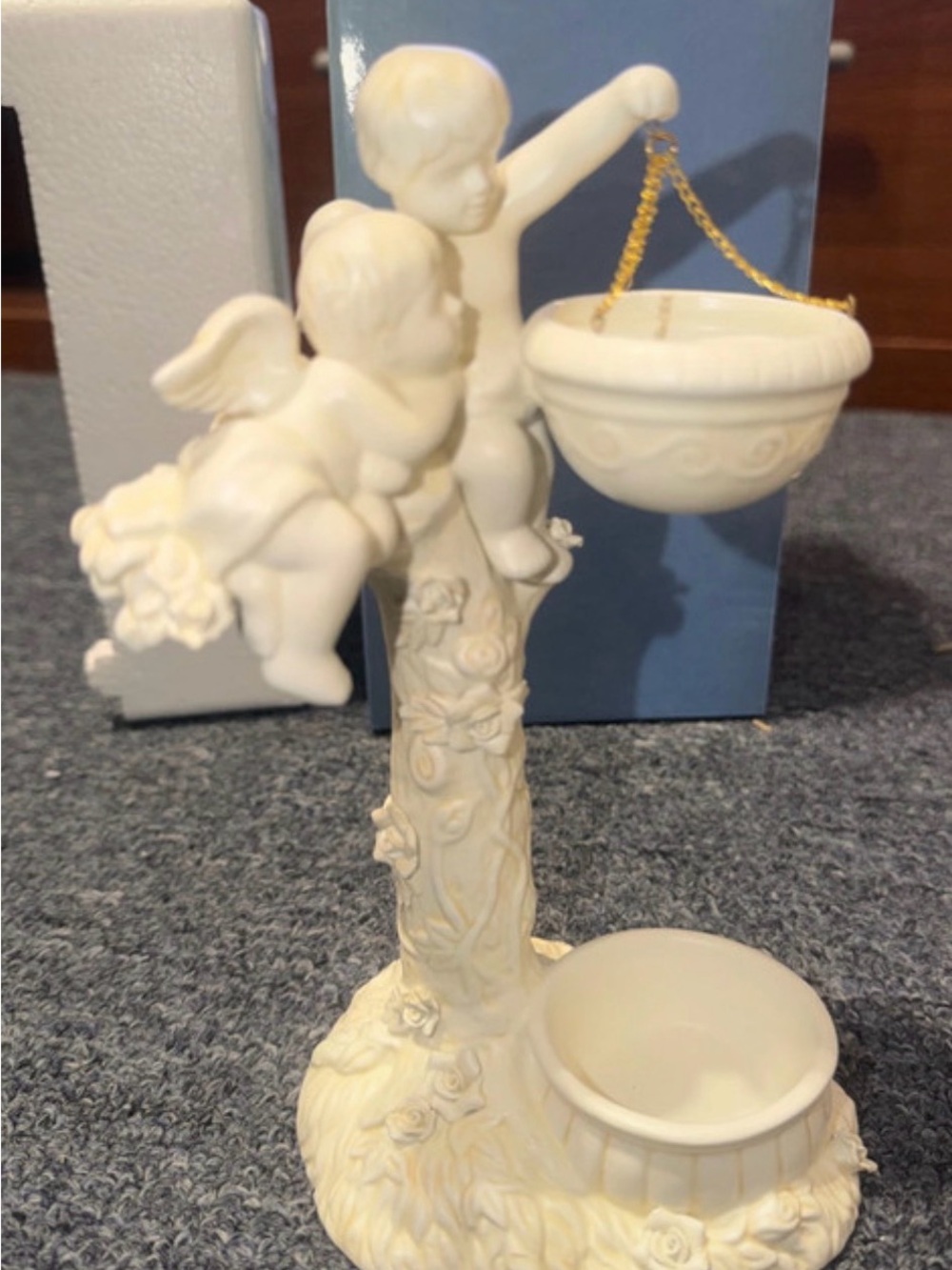 Ivory Cherub diffuser Figurine. Oil and teal light candle included